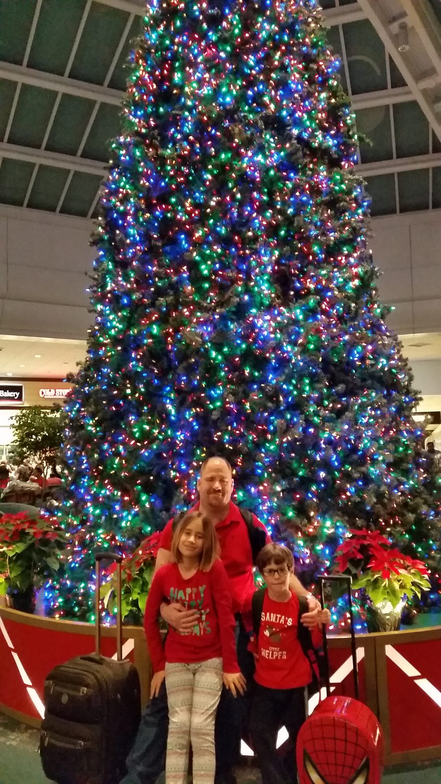 Kathy and the kids under the Christmas tree