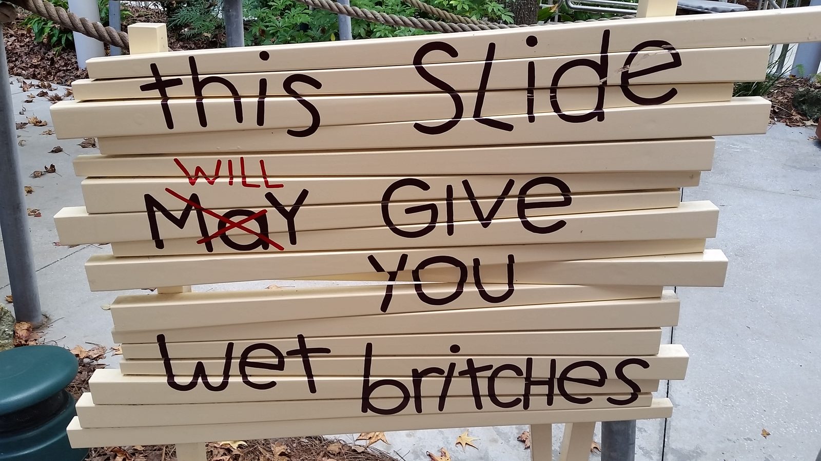 Sign warning this slide will give you wet britches