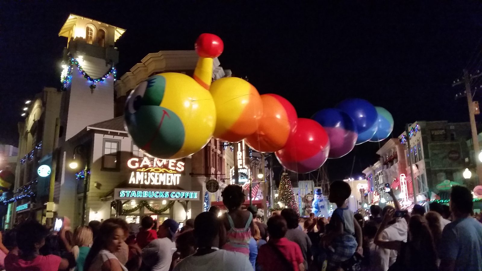 Rainbow caterpillar balloon in the holiday parade