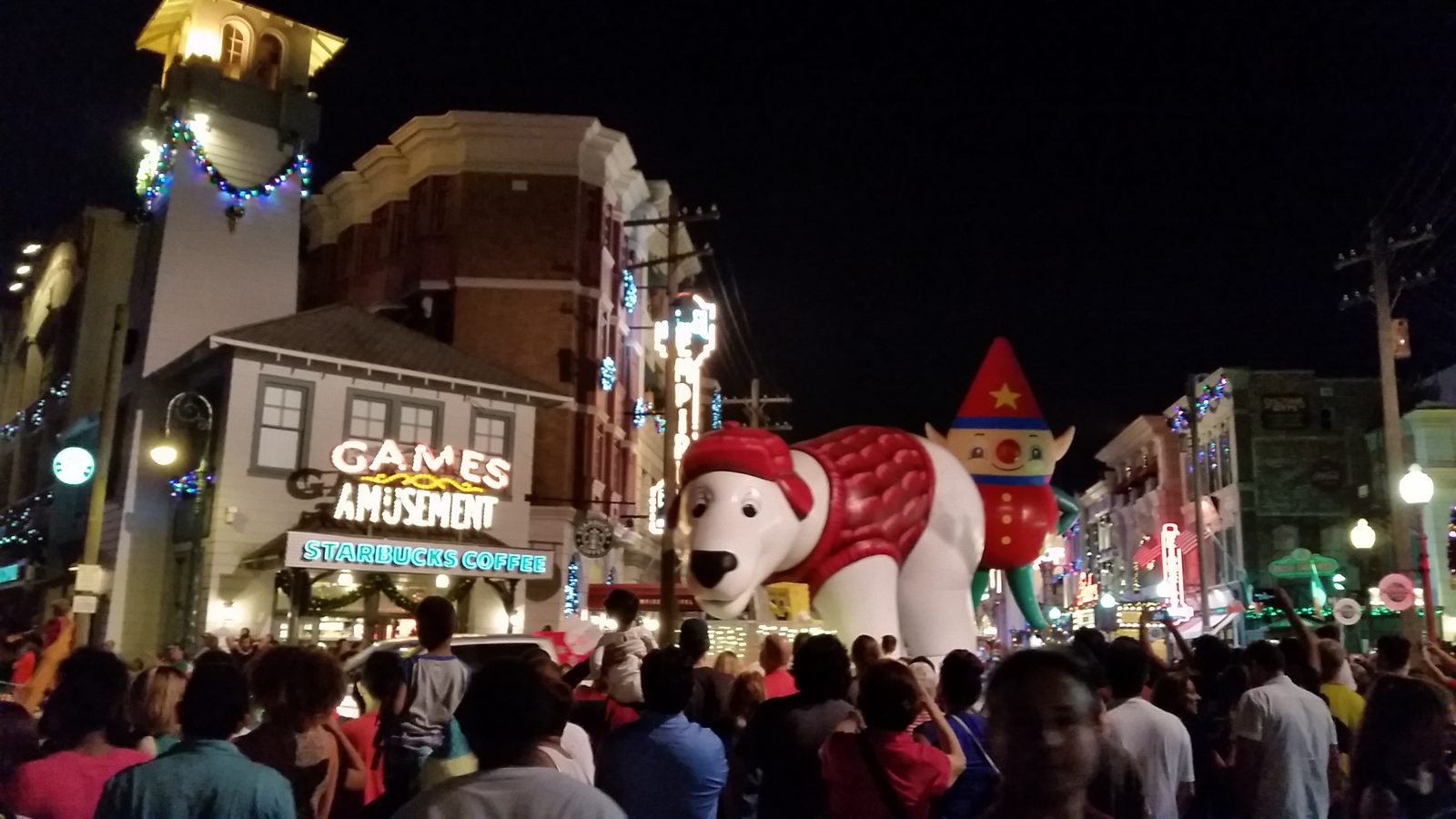 Polar bear and elf balloons coming down the parade route