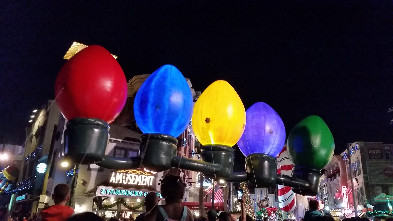 Giant light bulb balloons in the holiday parade