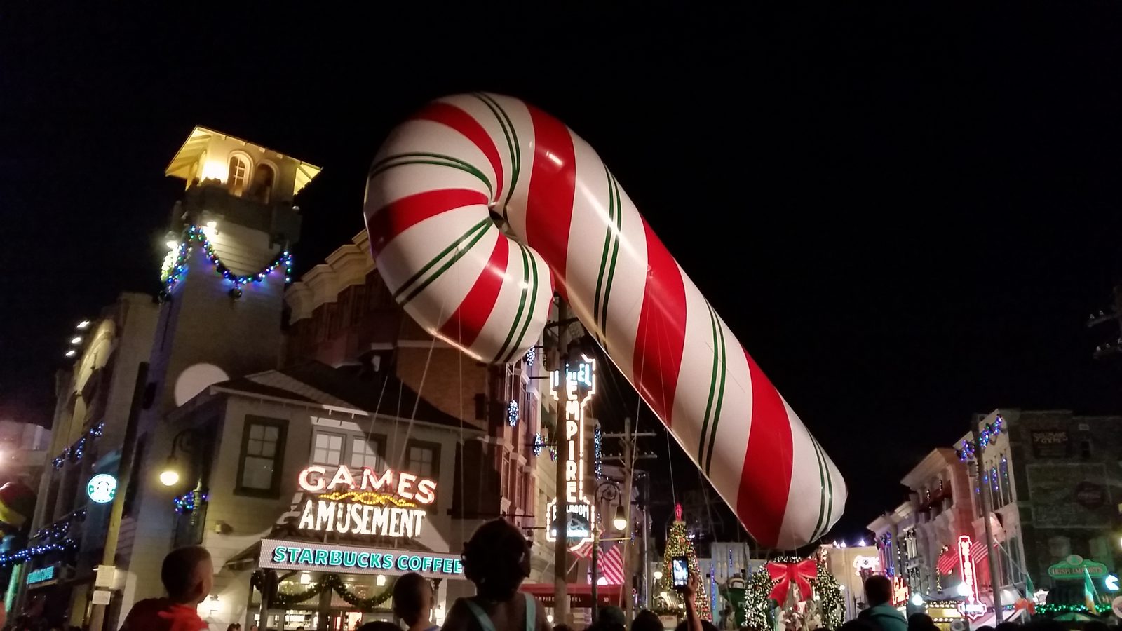 Candy cane balloon floating over the parade