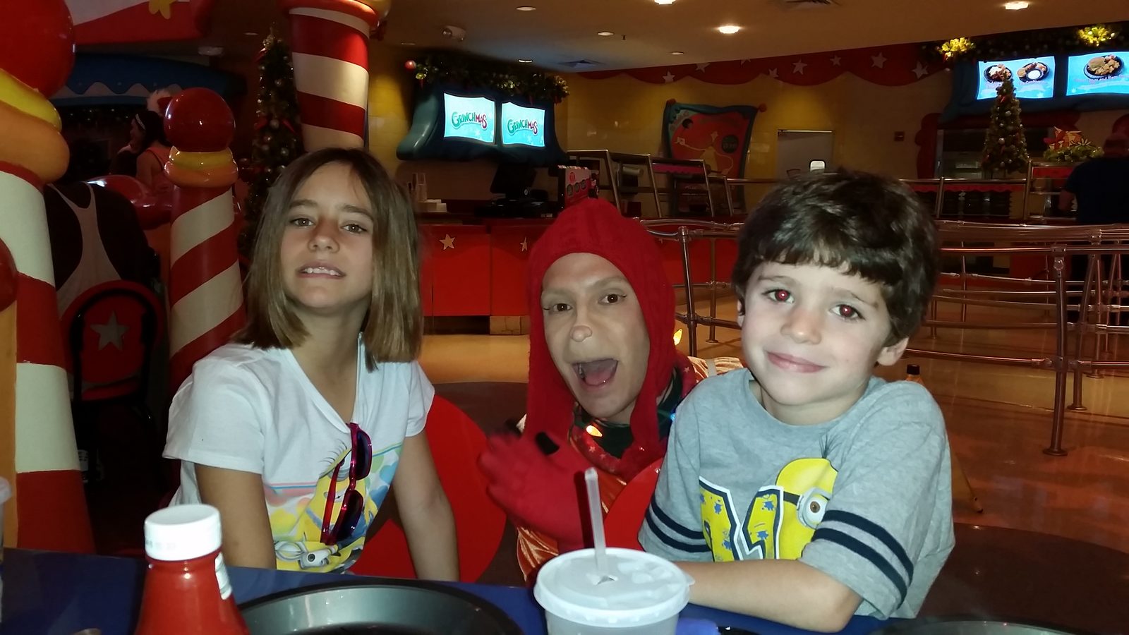Lisa and Thomas photobombed at the Grinchmas breakfast