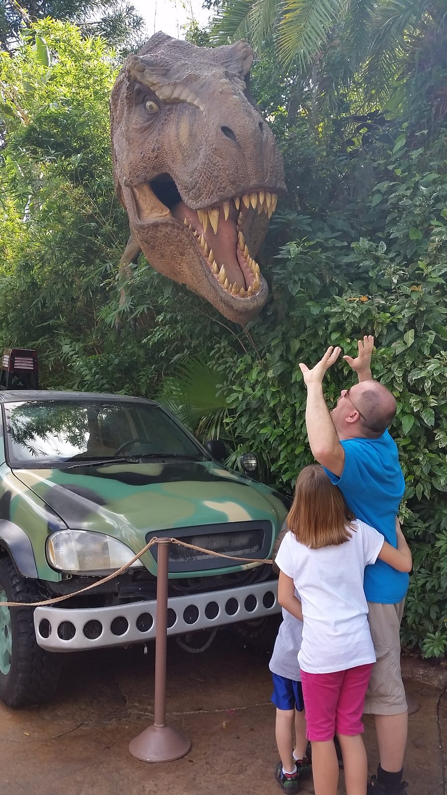 Reaching up to the Jurassic Park T-Rex