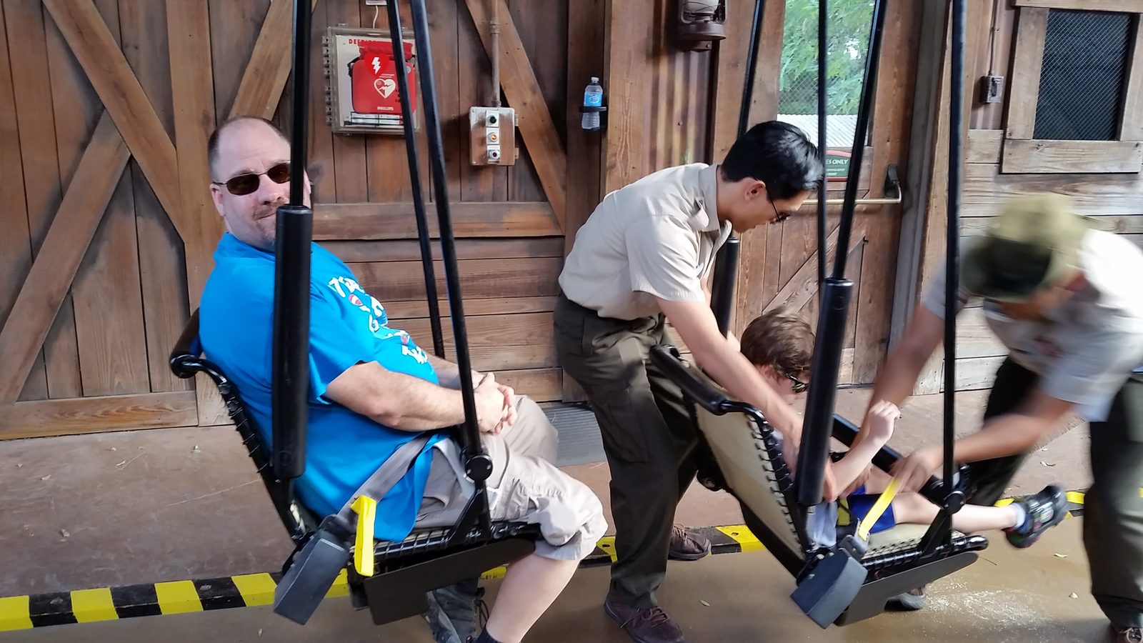 Getting strapped in for the Jurassic Park ride