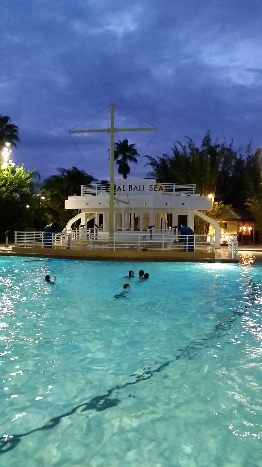 Dusk at the Royal Pacific pool and its ship