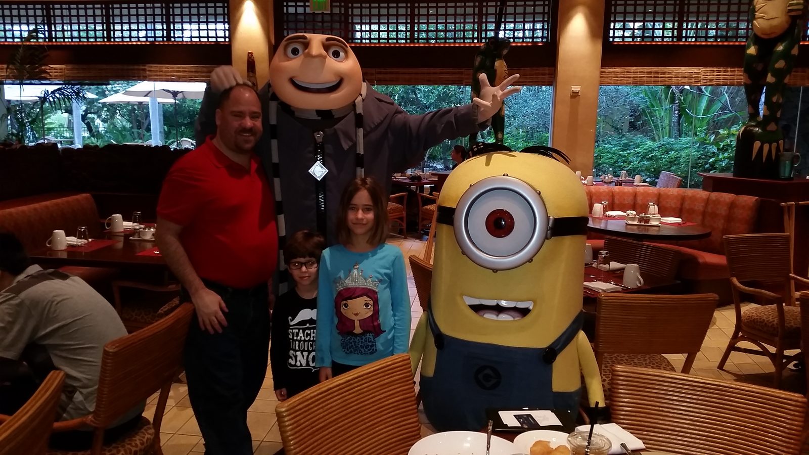 Our family with Gru and a Minion