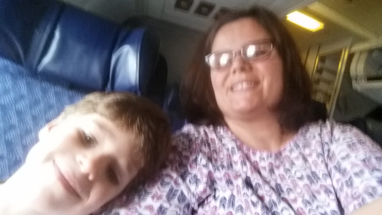 Thomas and Kathy resting on the flight home