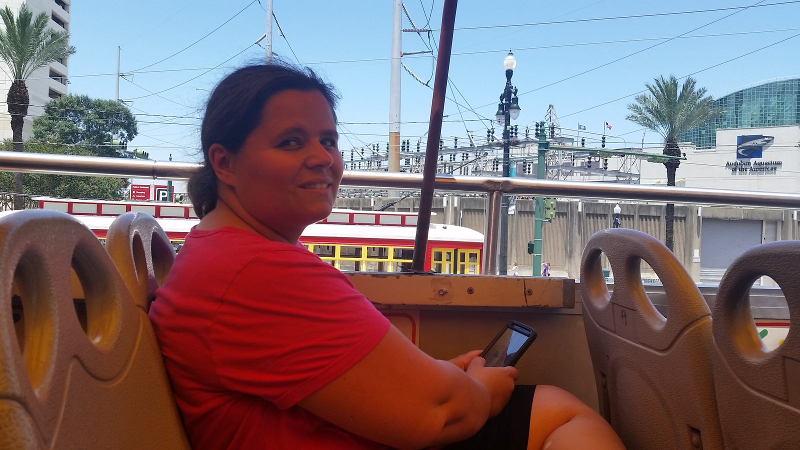 Kathy aboard the open-top sightseeing bus