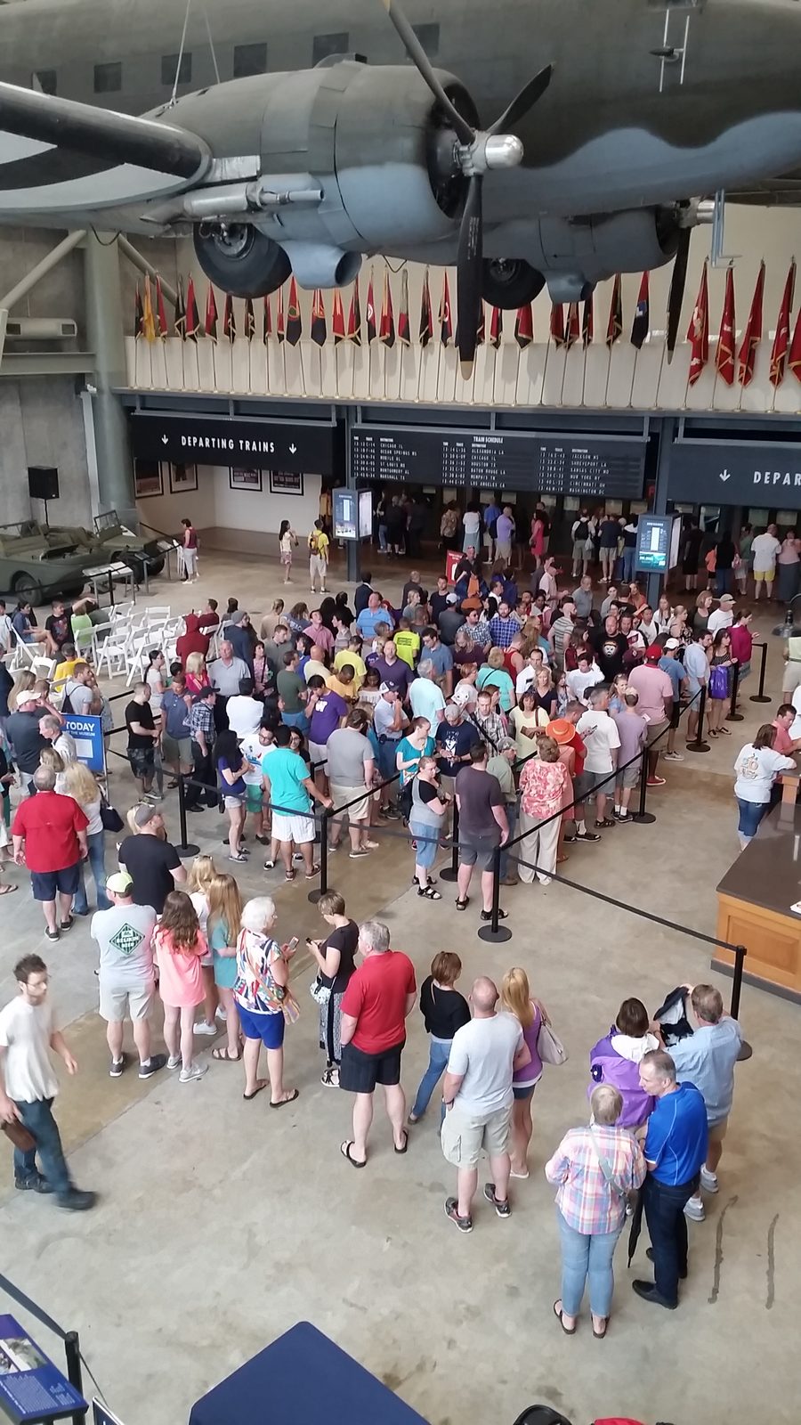 The line into the Freedom Pavilion, aircraft overhead