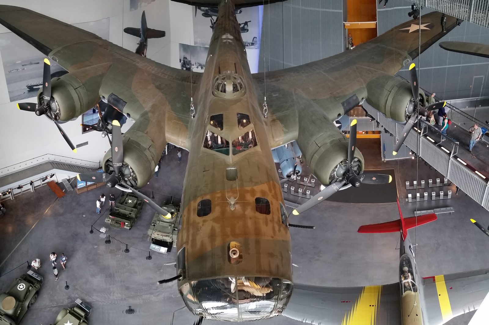 A bomber passes low overhead in the Freedom Pavilion