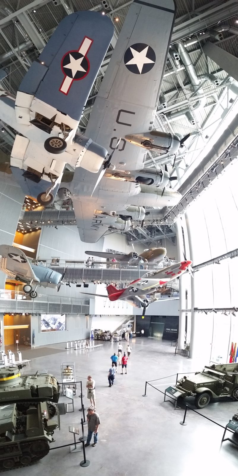 A red-tailed fighter over the museum floor