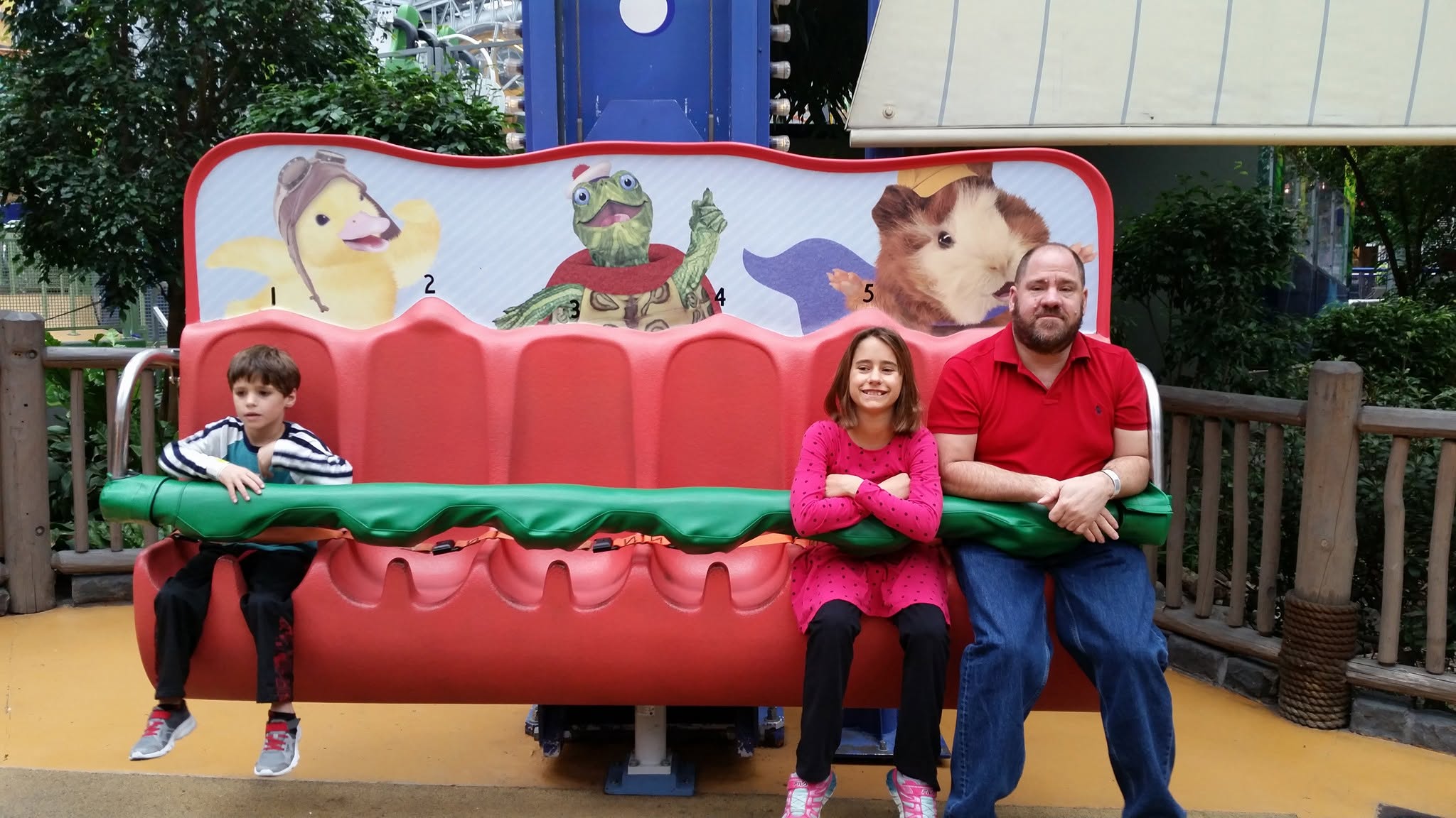 Thomas, Lisa and Michael on the big bench at Nickelodeon Universe