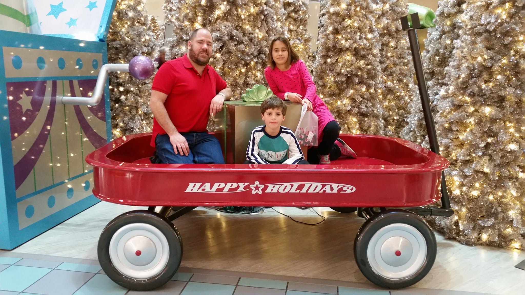 Thomas, Lisa and Michael in the giant holiday wagon