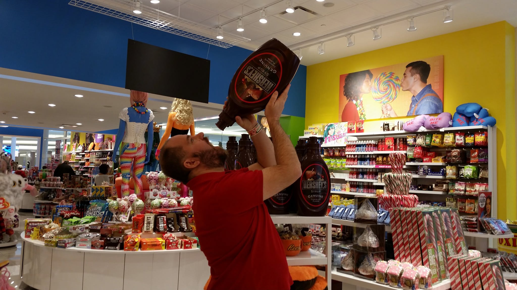 Michael with a giant bottle of chocolate syrup