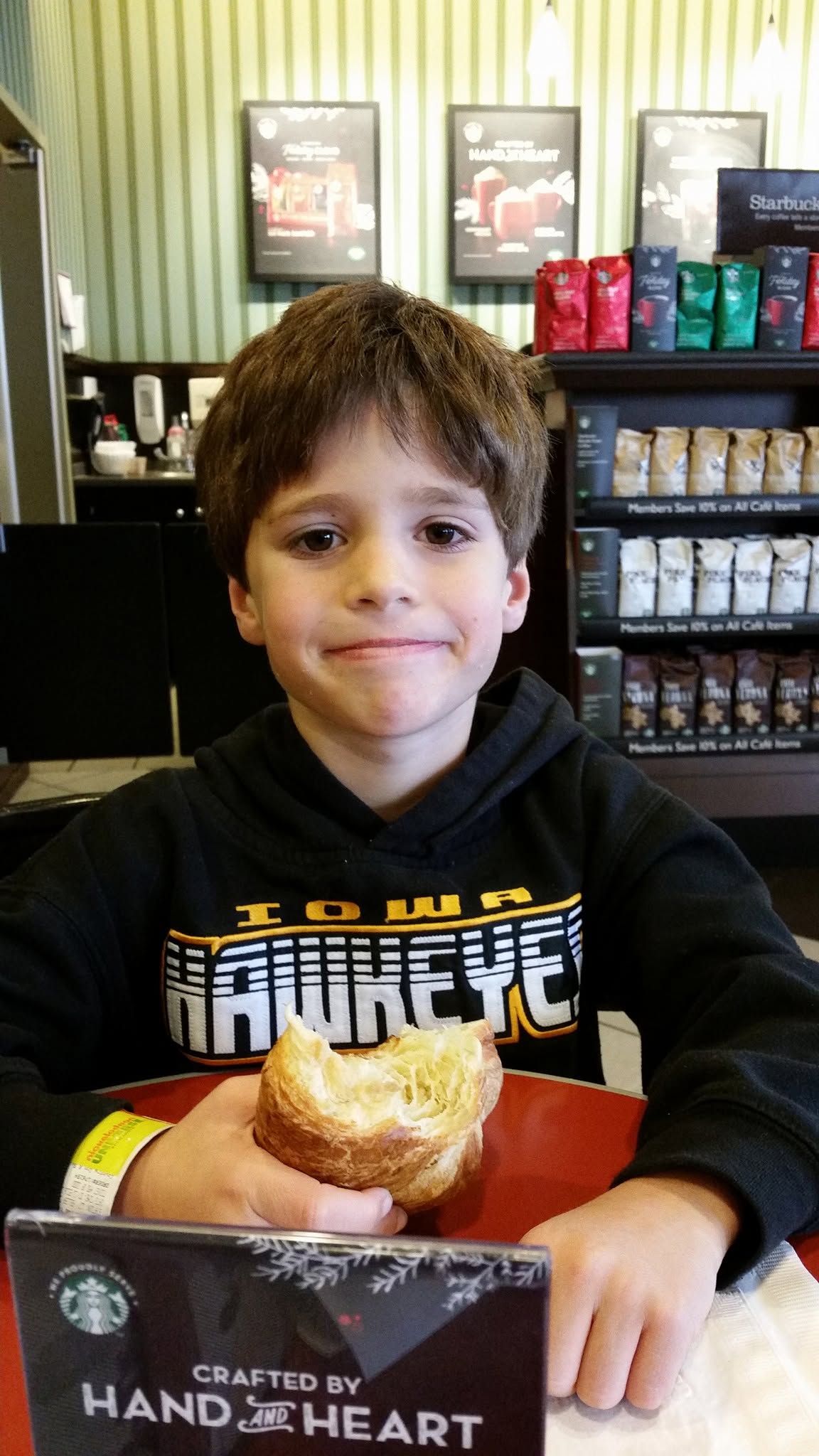 Thomas with his croissant at Barnes and Noble in Waterloo