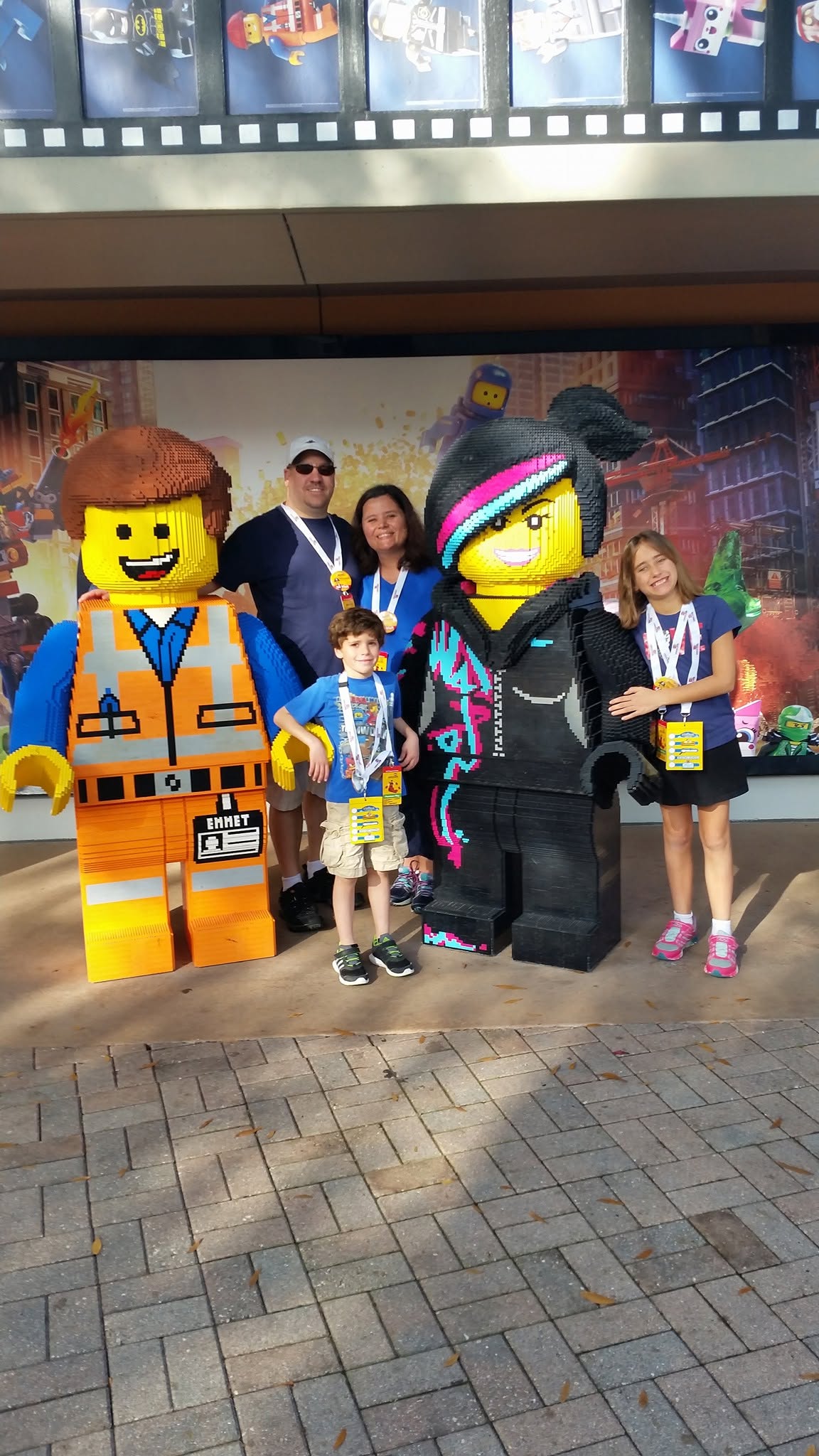 The four of us with Emmet and Wyldstyle at Legoland
