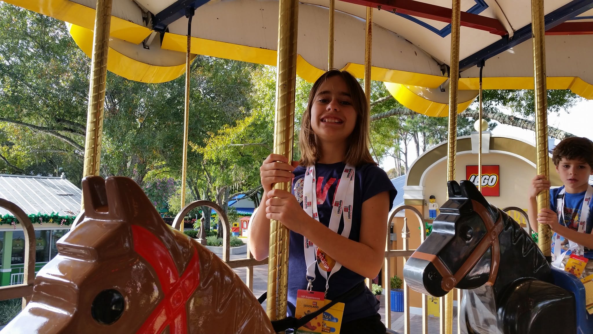 Lisa and Thomas on the carousel at Legoland