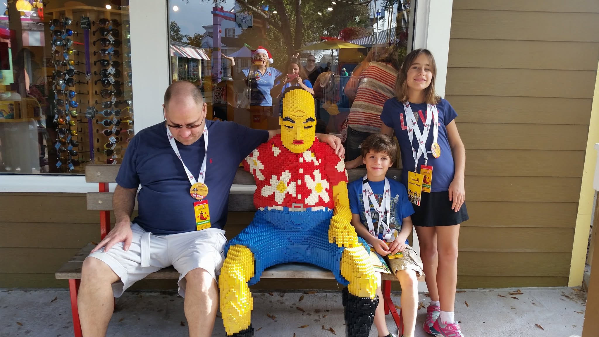 Michael, Thomas and Lisa on a bench with a big LEGO figure