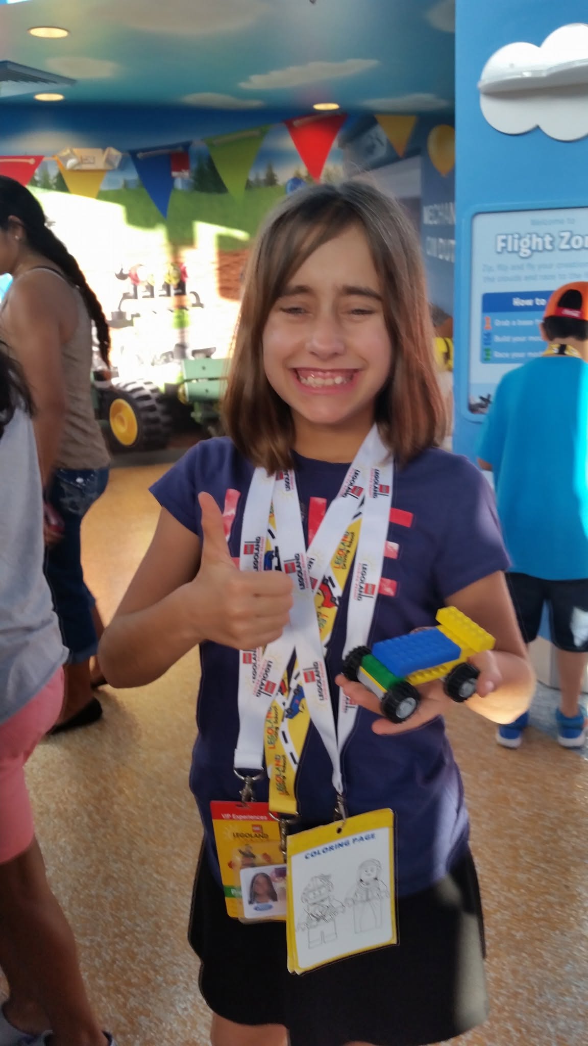 Lisa with the race car she built at Legoland