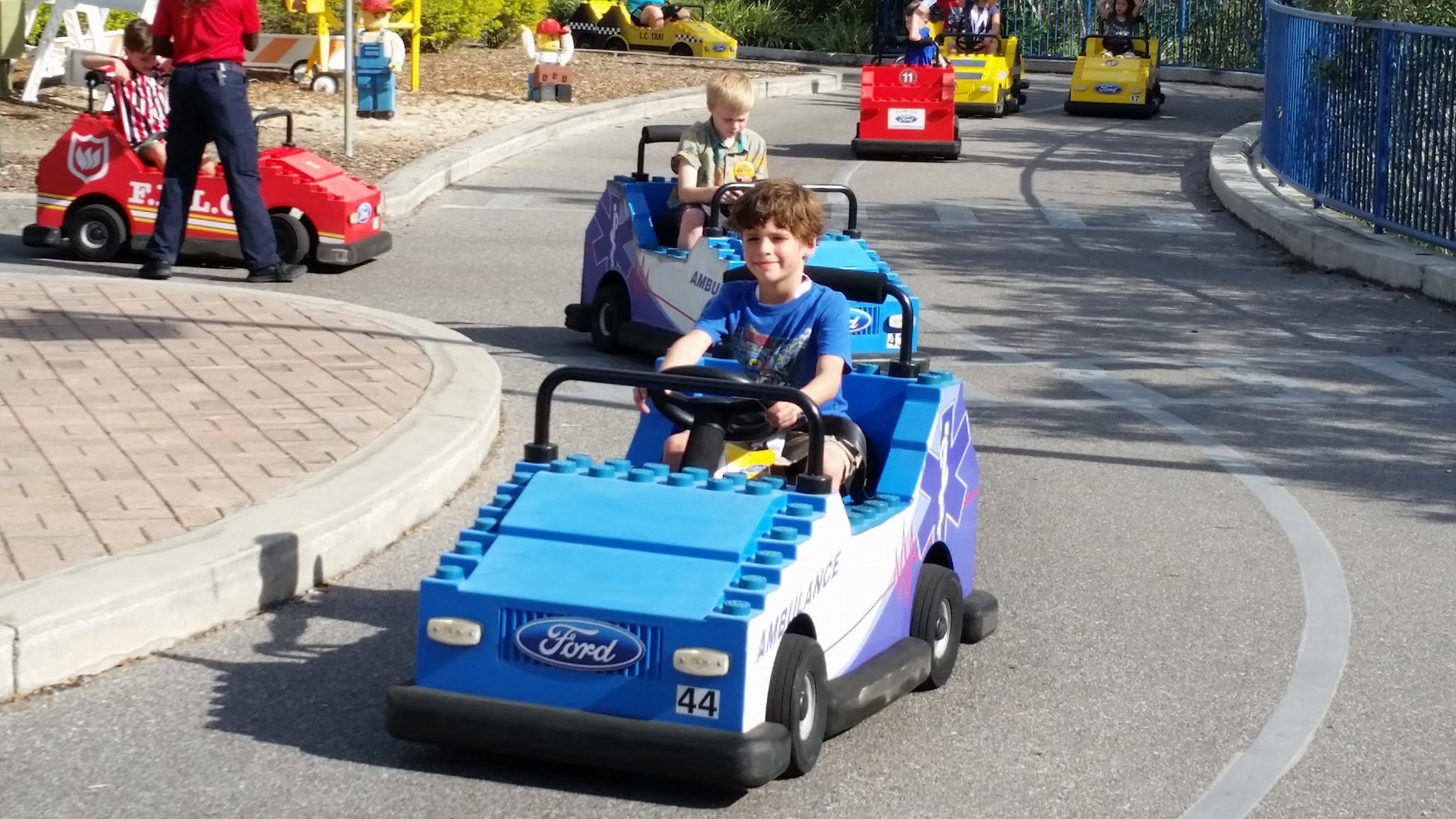 Thomas driving a mini car on the kids' driving track