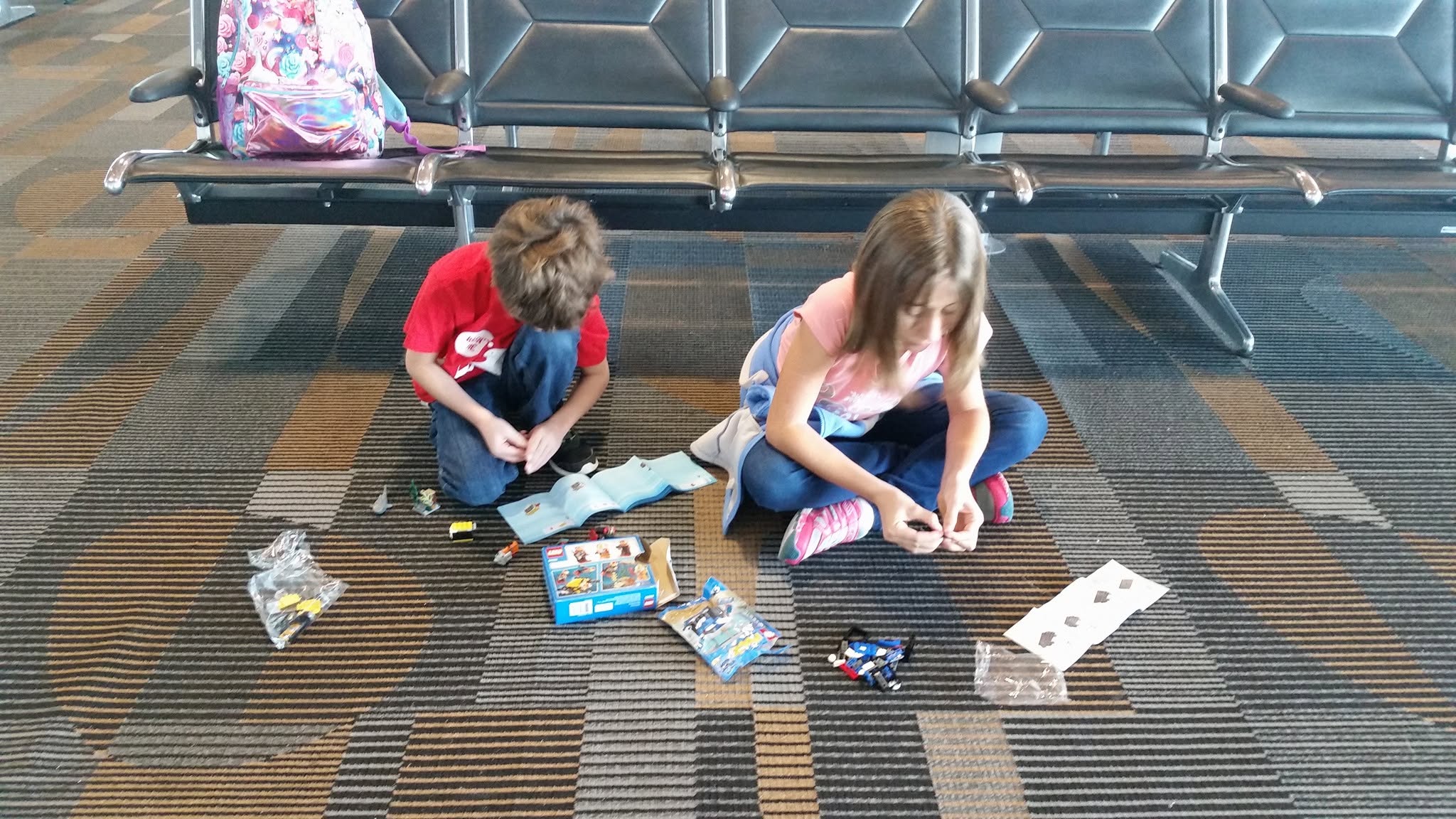 Thomas and Lisa building LEGO sets at the Tampa airport