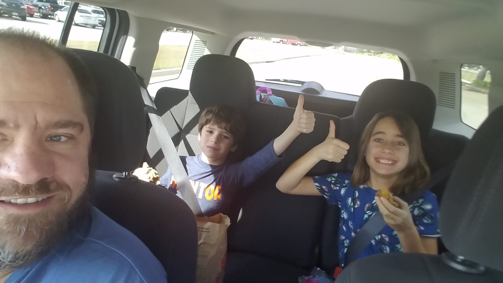 Thomas and Lisa in the rental car, thumbs up