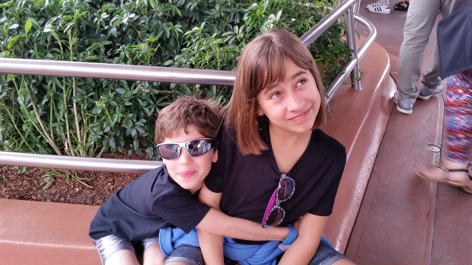Thomas and Lisa resting on a bench at Epcot