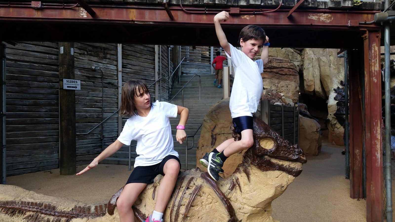 Thomas and Lisa climb the dinosaur dig site