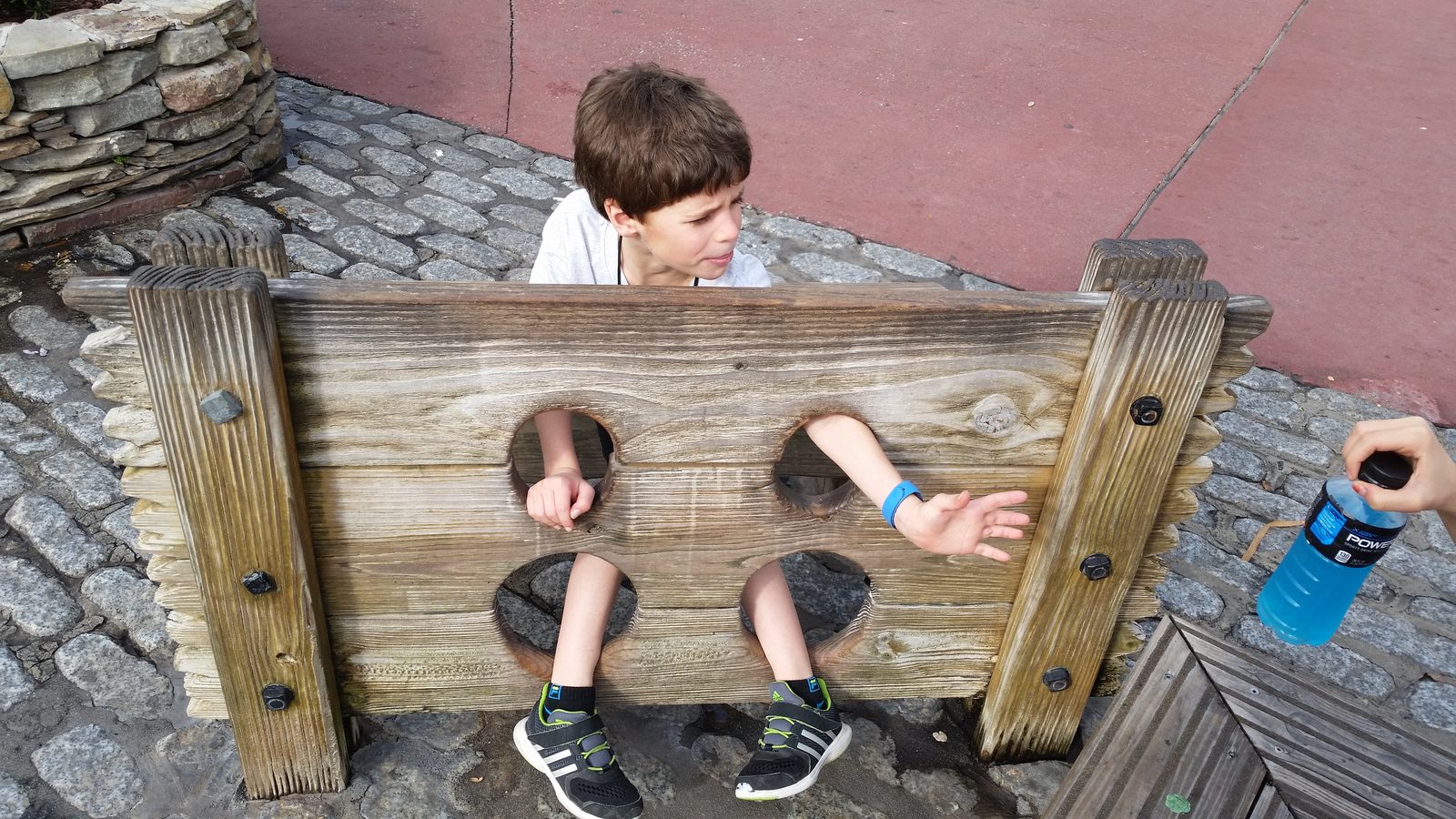 Thomas locked in the stocks in Magic Kingdom