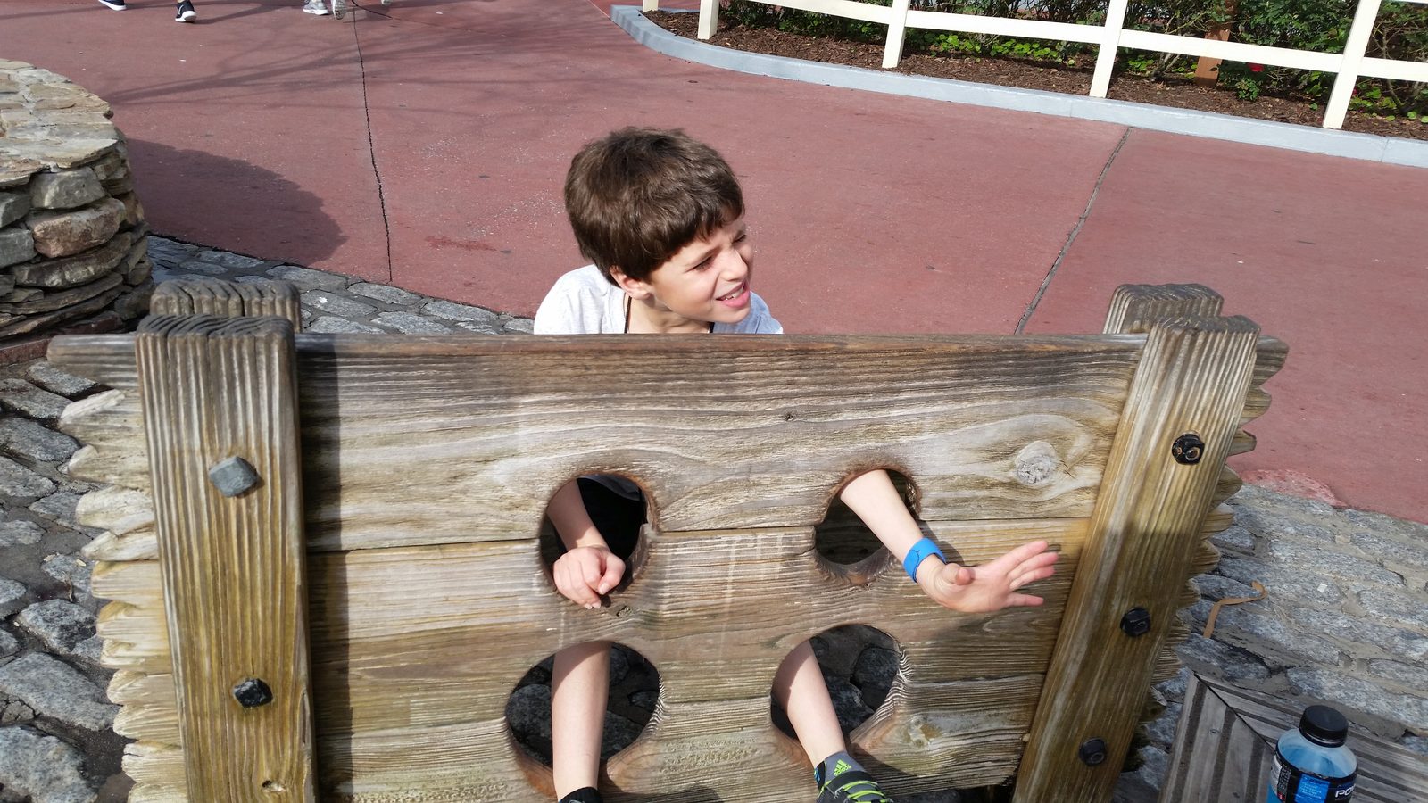 Thomas locked in the stocks at the Magic Kingdom