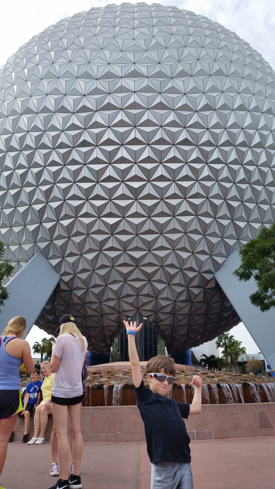 Thomas holding up Spaceship Earth