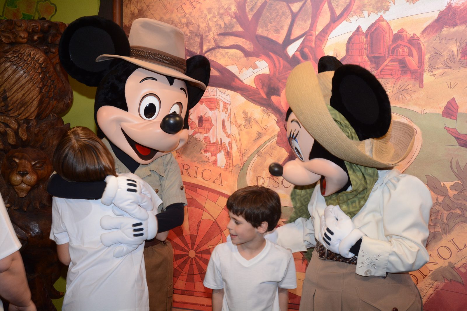 Lisa, Mickey Mouse in his safari outfit, Thomas and Minnie Mouse in her safari outfit at Animal Kingdom