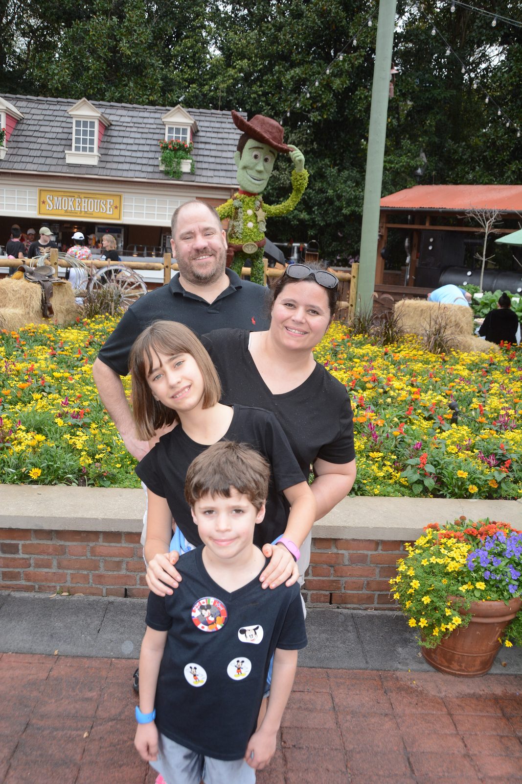 The four of us by the Woody topiary at Epcot
