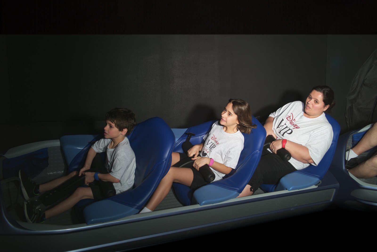The kids on Space Mountain in the dark