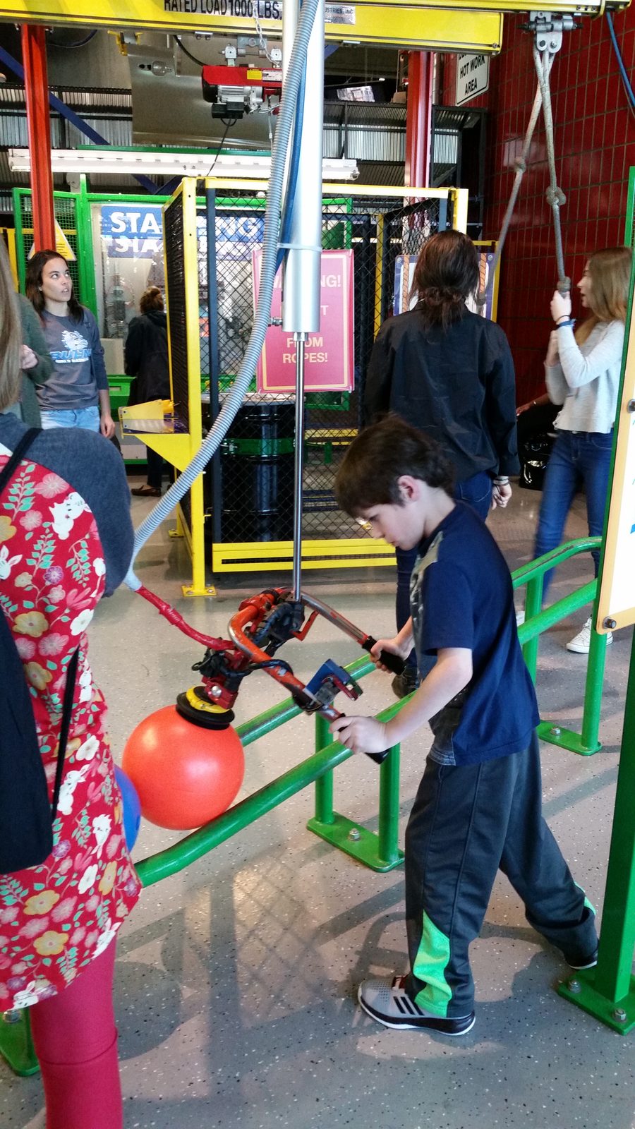 Thomas working the assembly line exhibit