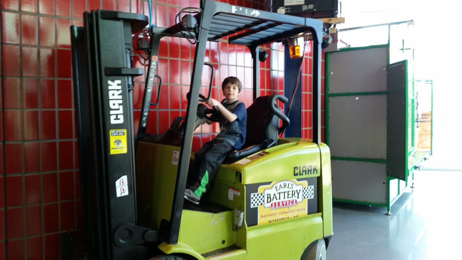 Thomas driving a toy forklift