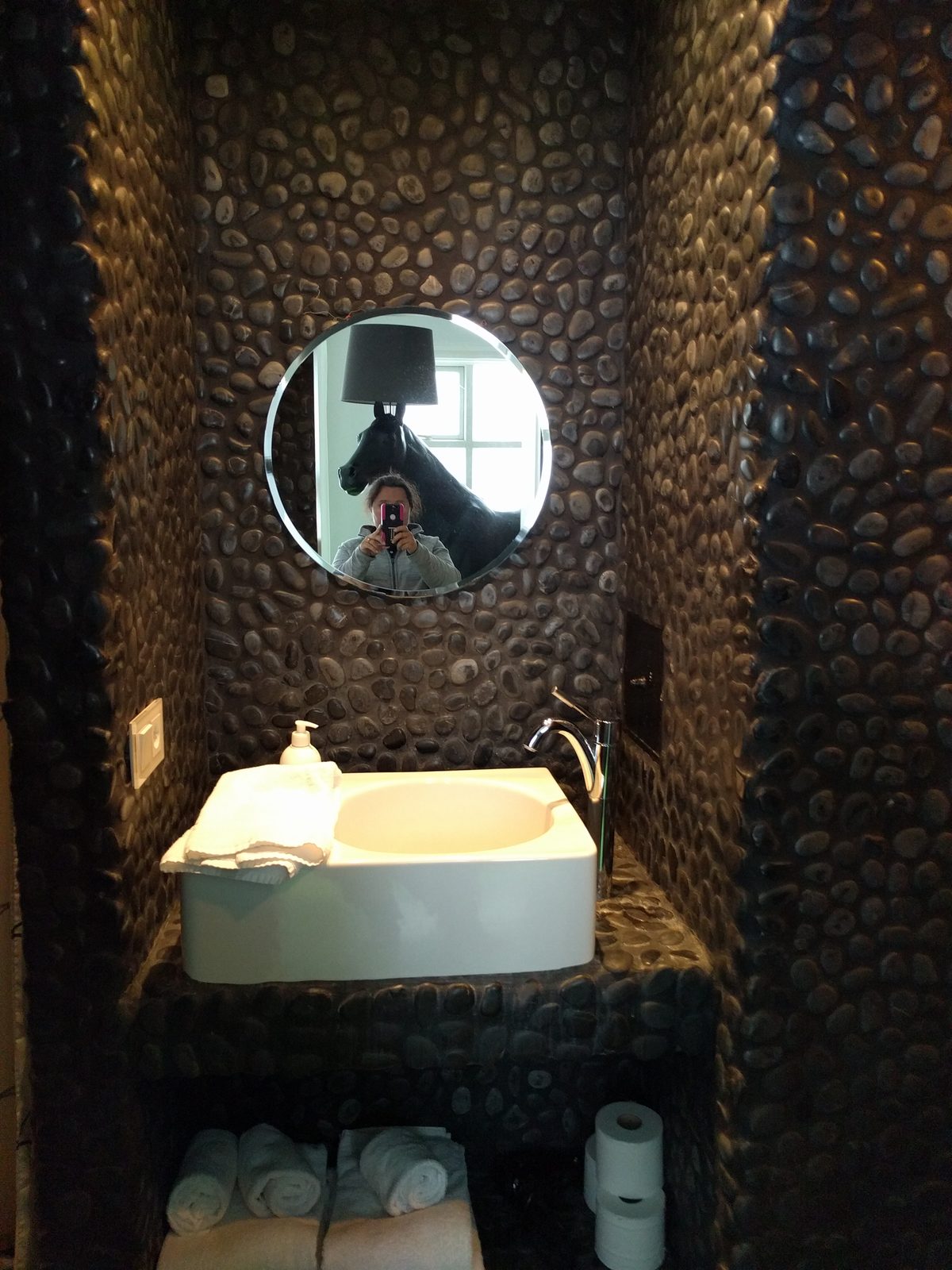 The pebble-walled bathroom in our apartment