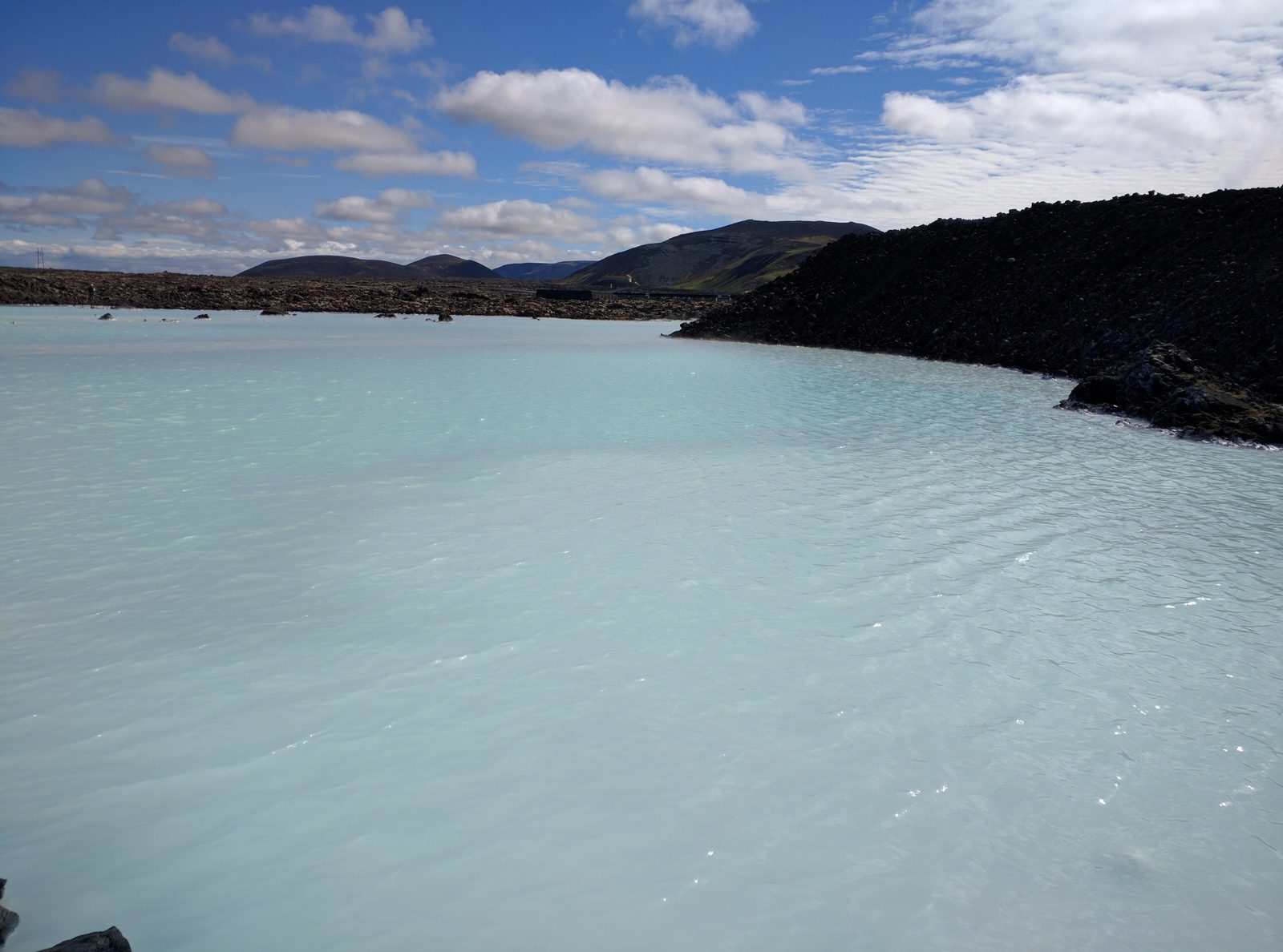 Milky blue water and black lava at the Blue Lagoon