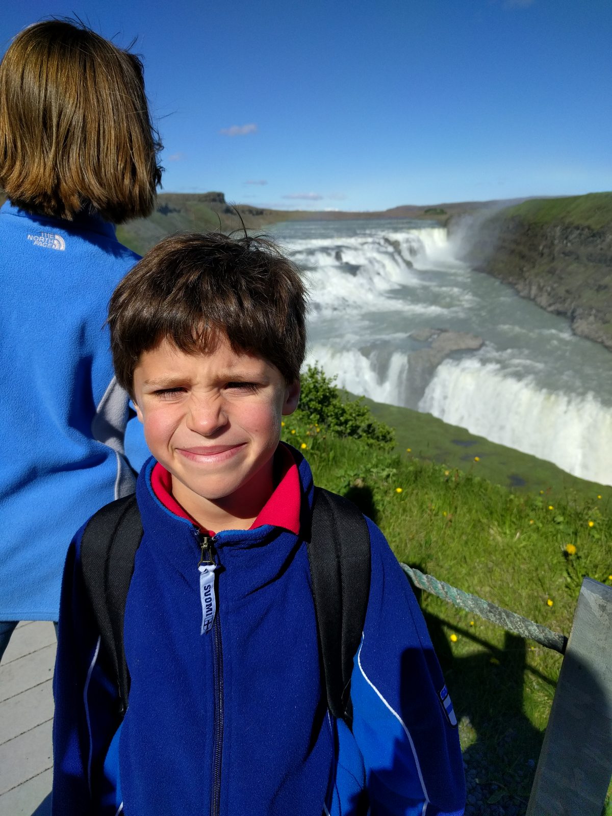 Thomas squinting in the sun at Gullfoss
