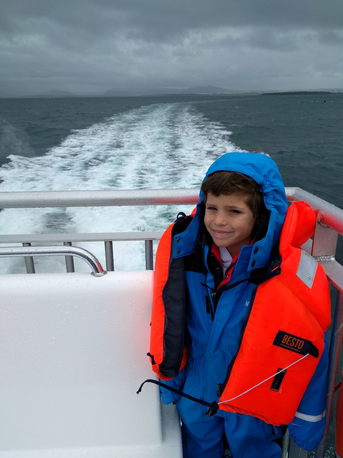 Thomas watching our wake off the back of the boat