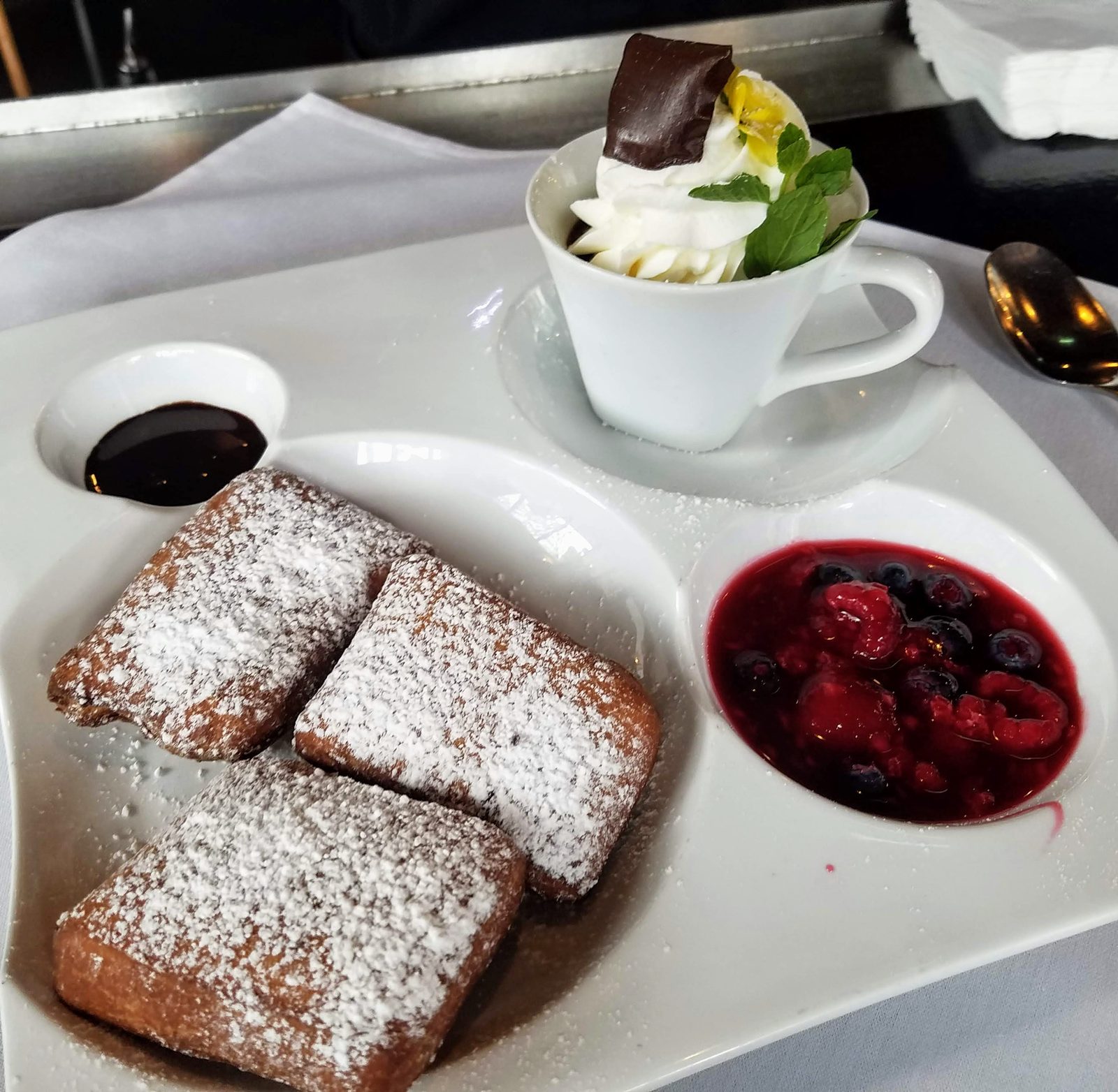 Powdered sugar pastries with berries for dessert