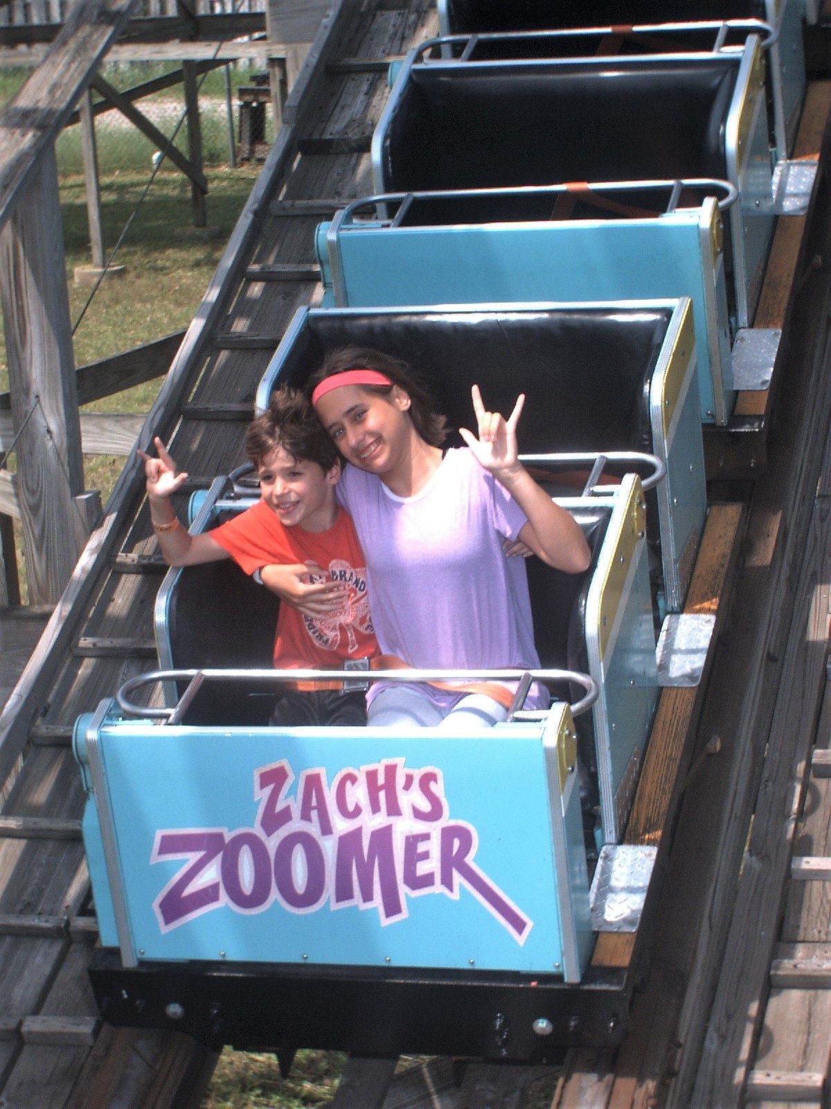 Lisa and Thomas, hands up on Zach's Zoomer