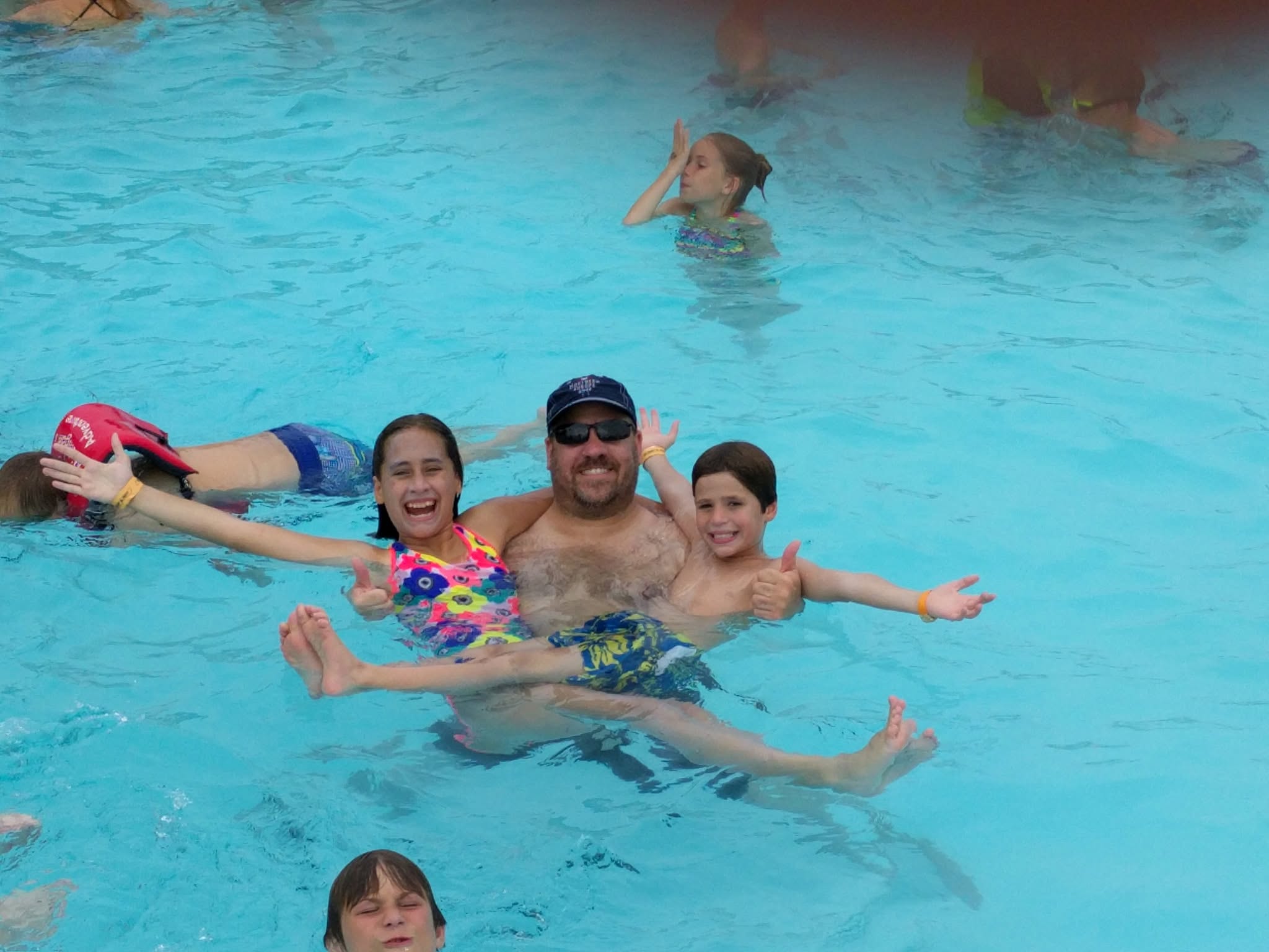 Lisa, Michael and Thomas floating in the wave pool at Michigan's Adventure