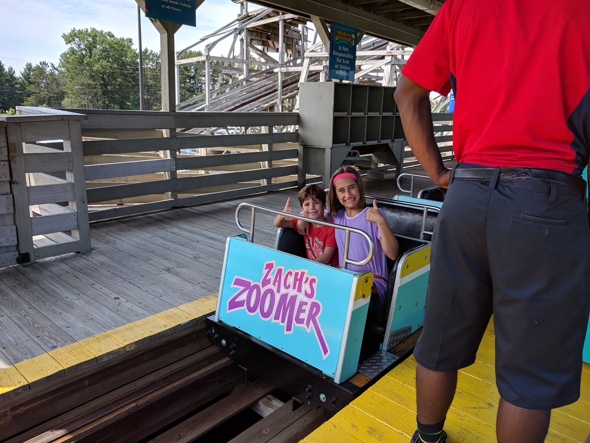 Thomas and Lisa in the front row of Zach's Zoomer