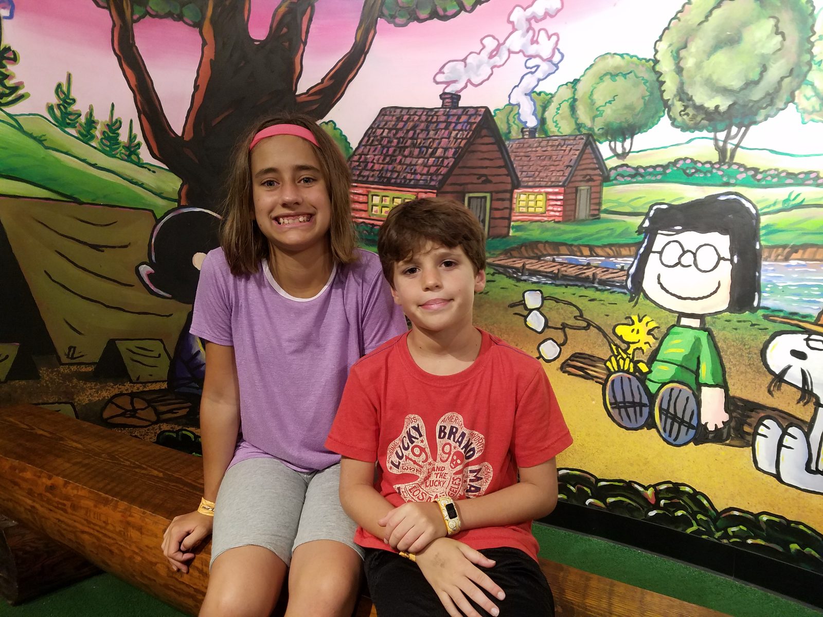 The kids at the Peanuts mini golf hole
