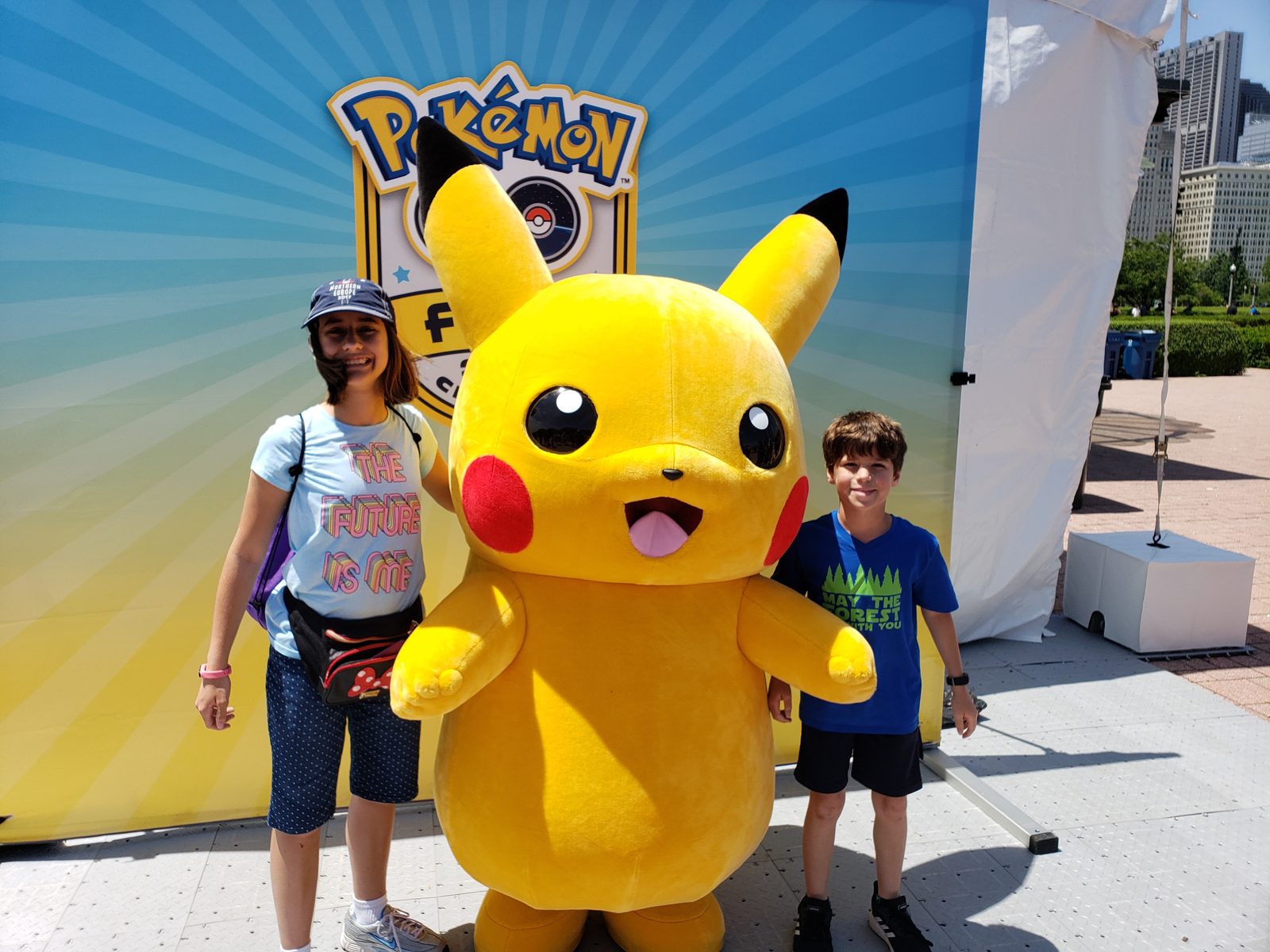 Lisa and Thomas with Pikachu