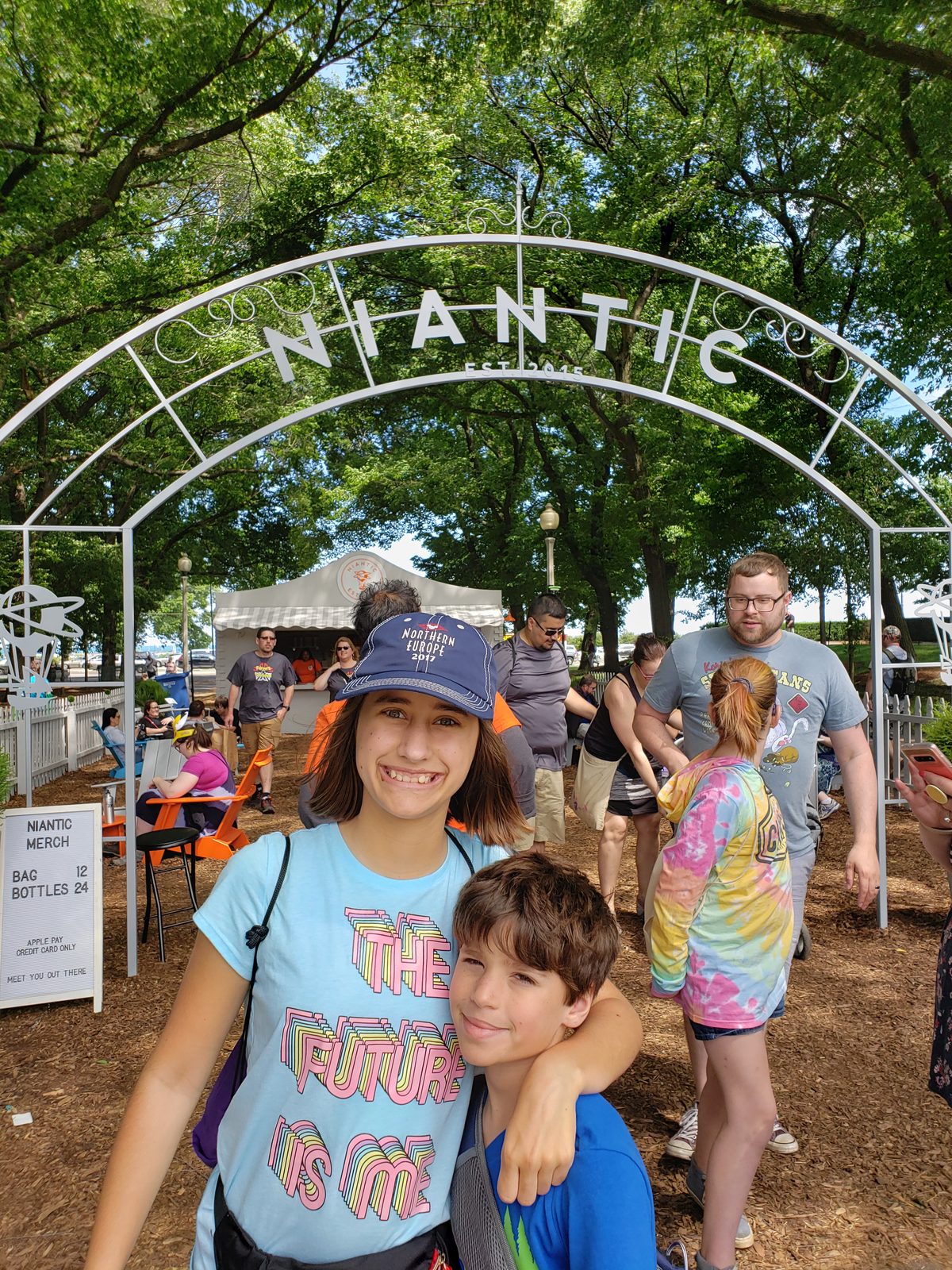 Lisa and Thomas walking through the Niantic arch