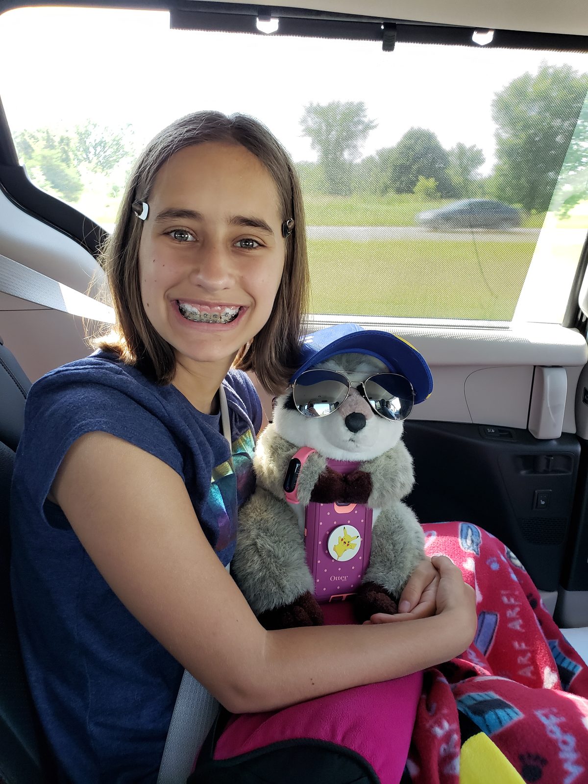 Lisa and a stuffed friend on the drive up