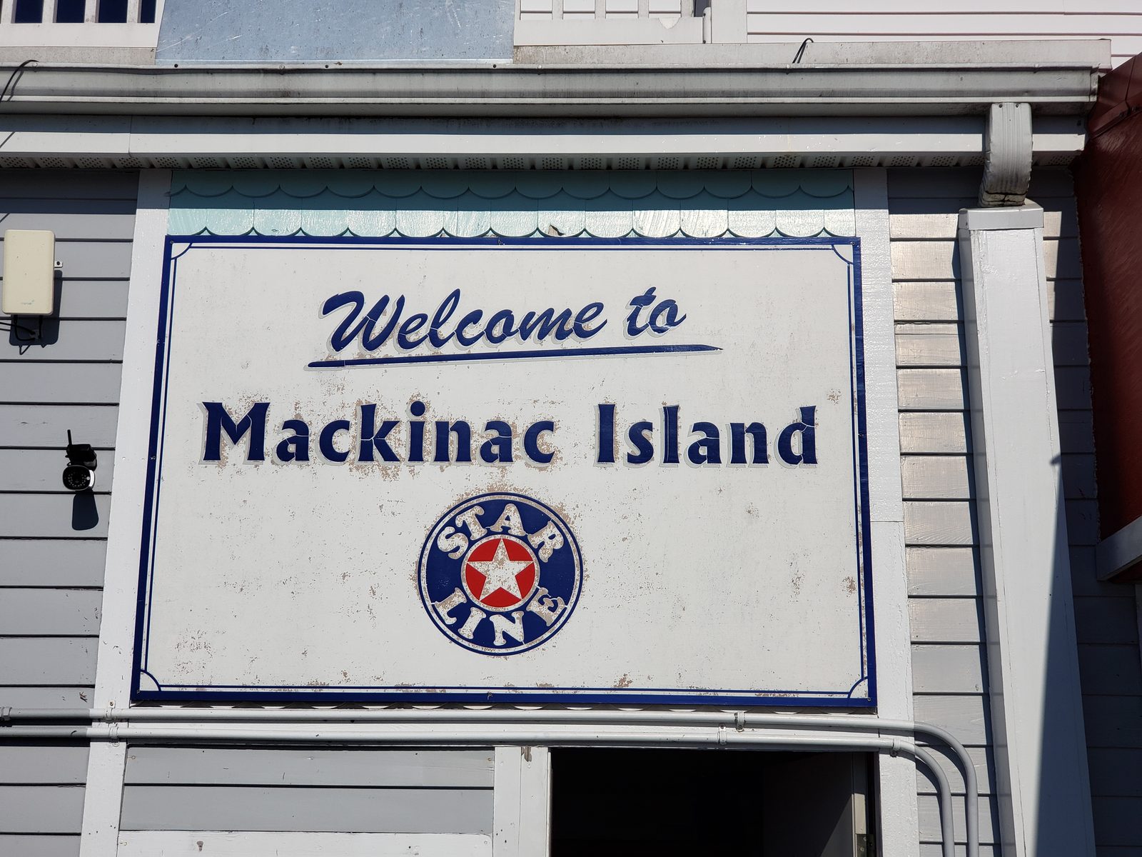 Welcome sign at the Star Line dock on Mackinac Island